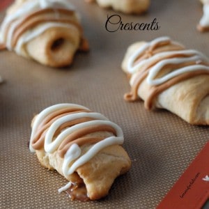 Fun size PayDay candies are hidden inside a Pillsbury crescent roll for a gooey sweet treat! www.lemonsforlulu.com