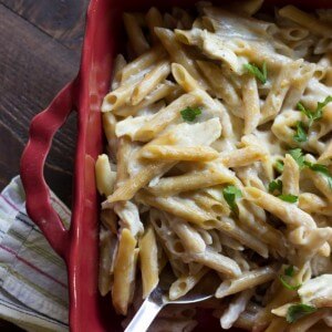 Garlic pasta is rich and creamy with bits of chicken and flavorful roasted garlic! www.lemonsforlulu.com