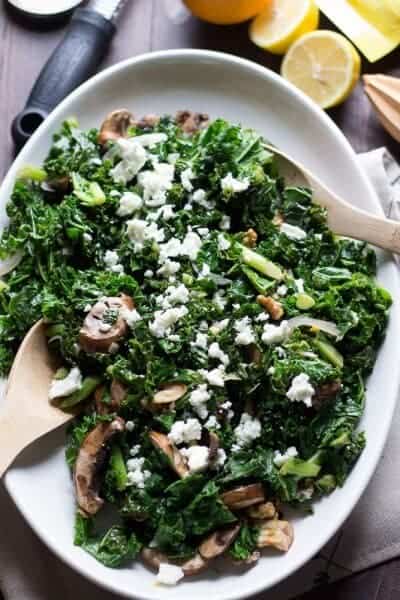 This wilted kale salad is packed with goodness, between the baby bella mushrooms, the toasted walnuts and the fresh citrus vinaigrette! Each bite is a powerful mouthful! www.lemonsforlulu.com #SplendaSweeties #SweetSwaps
