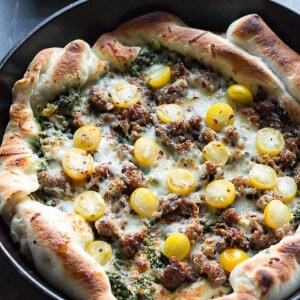 Sausage & Kale Pesto Pizza is fresh and light. It’s a quick weeknight meal that will leave your belly feeling happy and satisfied! lemonsforlulu.com
