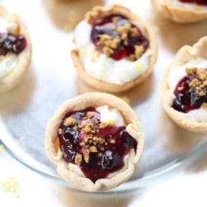 Lemon Blueberry Mini Pies are the perfect two bite desserts! They are light, tangy and perfectly tasty! lemonsforlulu.com