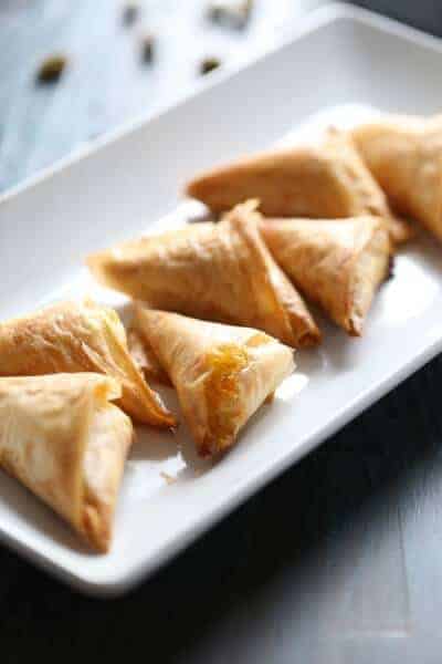 Flakey filo dough is wrapped around cream cheese, pistachios and apricot preserves. Not your ordinary appetizer! lemonsforlulu.com