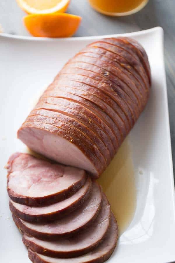 Slow cooker boneless ham with a simple apple cider sauce! lemonsforlulu.com