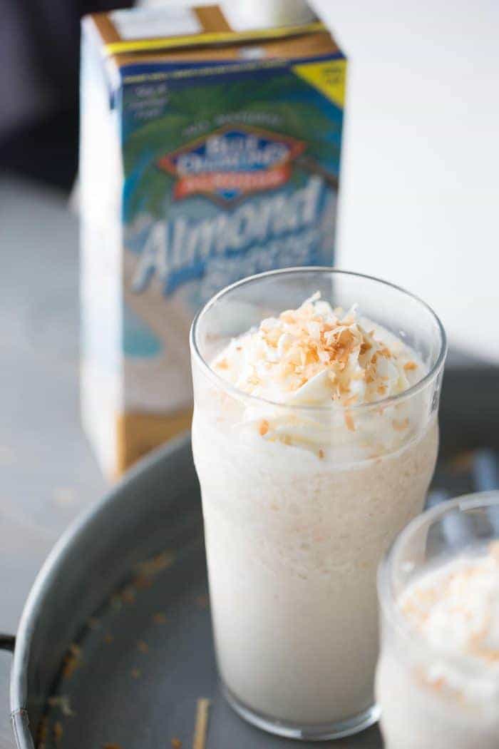 This frozen white hot chocolate combines to greats; white chocolate and toasted coconut! This cold beverage is a real sweet and creamy treat!