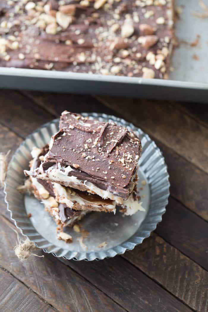 These cheesecake square are the best no bake treat you'll ever make! They have something for everyone between the coconut, the almonds, the cream cheese and the chocolate!