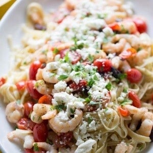 Greek style shrimp scamp with lots of fresh tomatoes, kalamata olives and feta cheese. lemonsforlulu.com