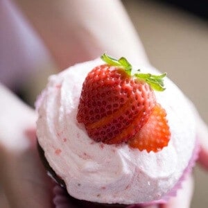 A from scratch buttercream recipe made with fresh strawberries. The perfect topping for rich chocolate cupcakes. lemonsforlulu.com