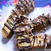 A crunchy biscotti cookie that has bee dipped in caramel and covered in toasted coconut and chocolate. The perfect partner for your morning coffee! lemonsforlulu.com