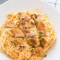 Chicken fettuccine alfredo like you've never tasted! Pasta noodles are coated with a light and creamy buffalo flavored alfredo sauce then topped with seasoned baked chicken!