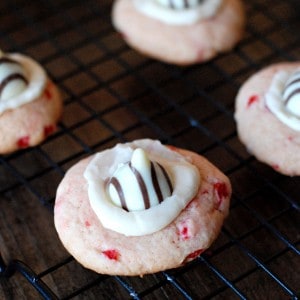 Cherry thumbprint cookies with a simple vanilla filling and Hershey’s Kisses! www.lemonsforlulu.com