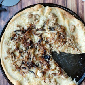 Pillsbury pizza crust topped with sweet caramelized onions, savory Italian sausage and creamy Gouda cheese! www.lemonsforlulu.com