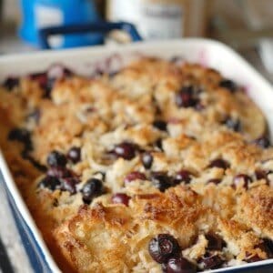 An easy and delicious over night baked french toast that is loaded with plump blueberries and lots of coconut! www.lemonsforlulu.com