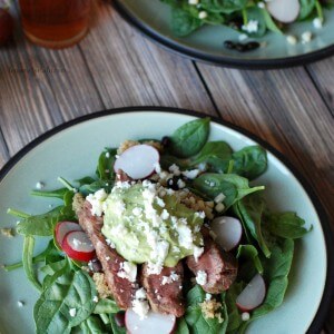 Pan seared steak rests on a spinach salad loaded with goodness! A simple avocado dressing finishes it all off! www.lemonsforlulu.com