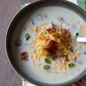 This easy potato soup uses mashed potatoes! Perfect for those Thanksgiving leftovers! www.lemonsforlulu.com