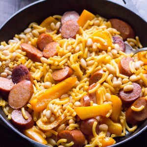 Cheesy Cajun Pasta starts with a box, but with peppers, andouille sausage and beans, you end up with a family pleasing, quick cooking meal! lemonsforlulu.com