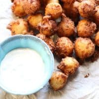 This tex mex hush puppy recipe is so fun and easy; one bite and you will be hooked! Don’t forget the buttermilk ranch dipping sauce! lemonsforlulu.com