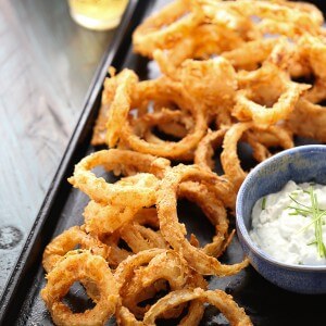 You won’t be able to stop with just one crispy onion ring! The bbq spiced rings are tender on the inside but crunchy on the outside. The blue cheese sauce is the perfect dip! lemonsforlulu.com