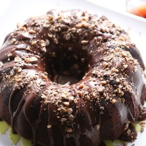 Guinness Chocolate Bundt Cake - This chocolate bundt cake is made richer with Guinness Stout. A silky chocolate glaze and crunchy toffee bits take it up another level. www.lemonsforlulu.com
