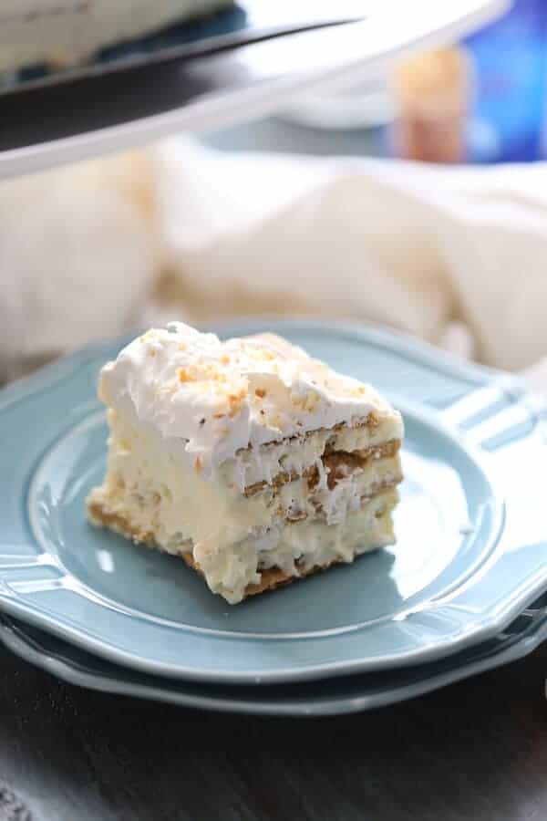 This vanilla coconut ice bake cake is such an easy no-bake treat! It’s rich and creamy too! lemonsforlulu.com #IDelight @InDelight