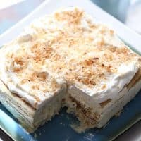 This vanilla coconut ice box cake is light and absolutley dreamy! A no bake treat that tastes purely decadent! lemonsforlulu.com #IDelight @InDelight