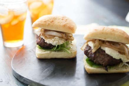 Boursin Cheeseburger Recipe starts with a savory beef patty and is finished off with creamy Boursin cheese and sweet caramelized onions. lemonsforlulu.com