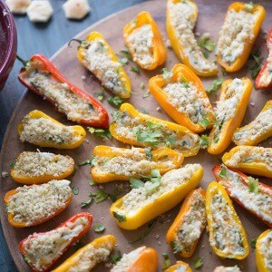 Mini stuffed peppers are grilled just until soft and the two kinds of cheese stuffed inisde begin to bubble! Each pepper is loaded with kale, cheese and bacon! lemonsforlulu.com #ChoppedAtHome
