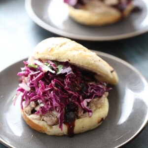 This is no ordinary pulled pork sandwich! Wasabi mayo, a tangy cilantro rich slaw is placed over a saucy pulled pork that is seasoned and flavored with lots of Asian spice. lemonsforlulu.com