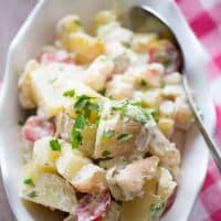 Grilled shrimp and grilled potatoes lend a smokey flavor to this easy Po Boy potato salad recipe! lemonsforlulu.com