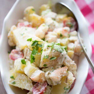 Grilled shrimp and grilled potatoes lend a smokey flavor to this easy Po Boy potato salad recipe! lemonsforlulu.com