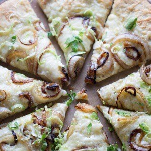 Easy homemade pizza topped with caramelized onions and Brussels sprouts! lemonsforlulu.com