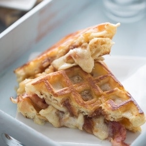 A savory waffle sandwich recipe with apple butter, bacon and fontina cheese! lemonsforlulu.com