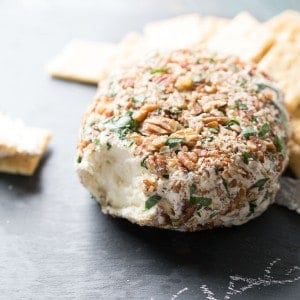 This easy cheese ball is crazy good! Roasted garlic and three kinds of cheese make this creamy appetizer positively addicting! lemonsforlulu.com