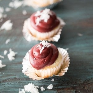 Easy coconut cupcakes with a deep flavored red velvet frosting. lemonsforlulu.com