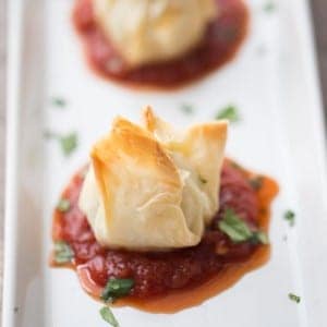 Chicken Parmesan meatballs wrapped in flaky sheets of fillo dough! lemonsforlulu.com