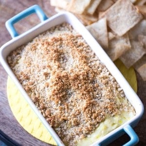 Dill pickle dip with cream cheese, Parmesan cheese and lots of dill pickles! The crunchy topping makes this easy dip taste just like a fried pickle! lemonsforlulu.com