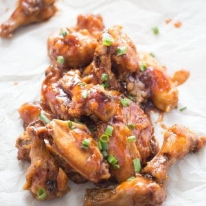 This oven baked chicken wings recipe is over the top delicious! Crispy baked wing are coated in a sticky stout and fig jam sauce!