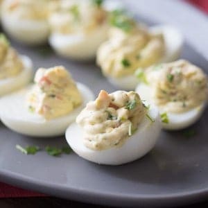 A simple deviled egg recipe with ranch seasoning and fresh garden veggies!