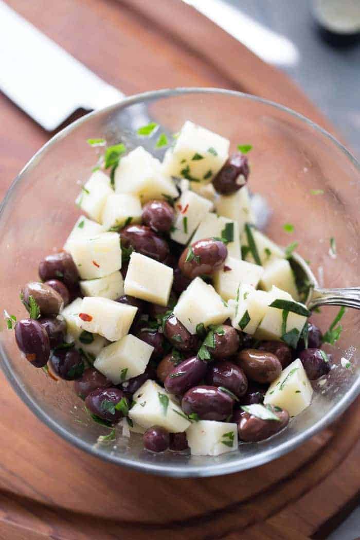 manchego cheese in marinated olives
