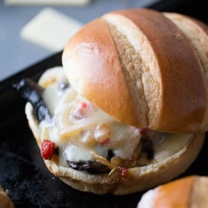 This veggie sandwich is filled with meaty portobello mushrooms and pepper. Tangy white cheddar cheese is melted on top to hold it all together!