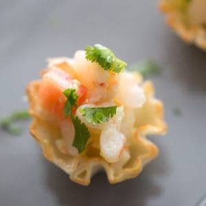 Ceviche is a latin appetizer made with shrimp, citrus juices, avocados and a little bite from red onion! It is so fresh and so simple!