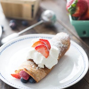 Red White and Blue dessert crepes start with a cake mix but end with fresh fruits, homemade whipped cream and lots of smiles!