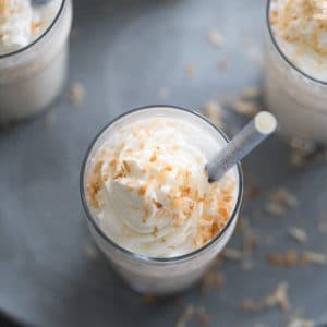 This frozen white hot chocolate combines to greats; white chocolate and toasted coconut! This cold beverage is a real sweet and creamy treat!