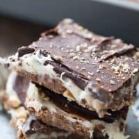 These cheesecake square are the best no bake treat you'll ever make! They have something for everyone between the coconut, the almonds, the cream cheese and the chocolate!