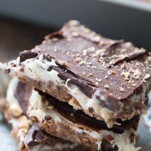 These cheesecake square are the best no bake treat you'll ever make! They have something for everyone between the coconut, the almonds, the cream cheese and the chocolate!