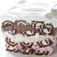 A Swiss Roll ice cream cake with so many lovely layers! Swiss Roll cakes are separated by layers of strawberry ice cream, vanilla ice cream and chocolate ice cream!