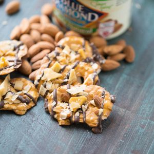 Chocolate covered pretzel start with dark chocolate that is topped with sweet, dried mangos, toasted caramel and whole almonds. This salty sweet snack will satisfy every craving!