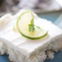 Mojito meets cake in this simple dessert recipe! A rum flling is soaked into fluffy white cake and then topped with a minty buttercream frosting!