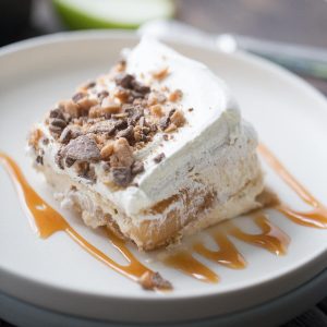 This eclair cake is like apple pie but better! Graham crackers are the "cake" layers that are held in place with apple pie filling and apple spiced pudding. Toffee bits crown the top!Fold in 12 oz whipped topping into pudding mixture.
