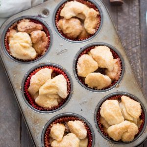 Monkey bread muffins are made with biscuits and stuffed with a sweet, apple filling!