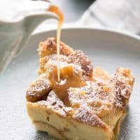 Tender sweet bread and cinnamon apples makes this bread pudding recipe taste amazing! The caramel sauce on top is the crowning glory!